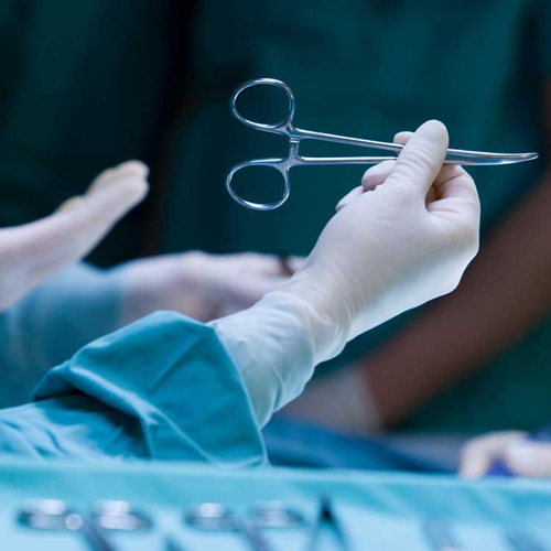 General Surgeon Conducting Pre-Surgery Assessment